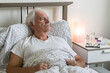 © kirill - aging senior man male bed sick ill alone retired resting virus unhappy sad