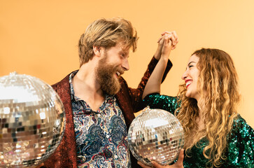 Wall Mural - Happy young couple doing party and dancing in disco club