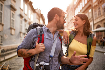 Wall Mural - Happy tourist couple sightseeing; Traveller lifestyle