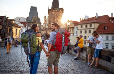 Happy tourist couple sightseeing; Traveller lifestyle