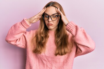 Poster - Young blonde woman wearing casual clothes and glasses with hand on head, headache because stress. suffering migraine.