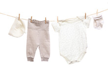 Baby Clothes On A Clothesline On White  Background