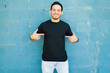 © AntonioDiaz - Excited man wearing a black casual t-shirt