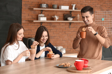 Wall Mural - Business colleagues drinking coffee in office