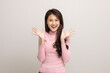 © Chanakon - Young beautiful asian teenager girl in pink shirt standing and smile on isolated white background.