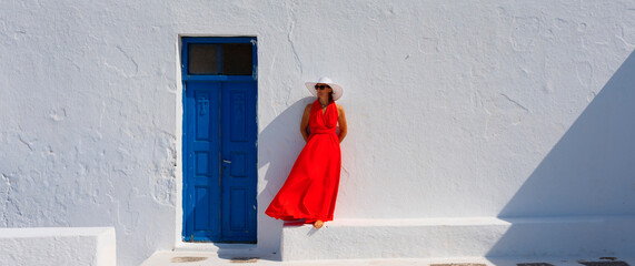 Wall Mural - Woman in front of church in Santorini