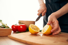 Slicing Lemon On The Board With A Knife Kitchen Cooking Ingredients
