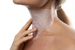 Woman with a moisturizing and anti aging sheet mask applied on her neck