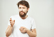 © SHOTPRIME STUDIO - bearded man in white t-shirt emotions anger expression