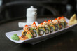 Delicious shrimp avocado sushi roll on a plate