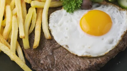 Wall Mural - Portugal dish Bitoque made from beef steak with a fried egg, rice, french fries and vegetables