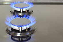 Modern Kitchen Stove Cook With Blue Flames Burning.