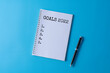 © youlanda - Word writing text goals 2022 in a notebook. Business concept.