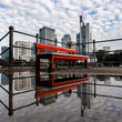 Frankfurt, Germany - June 4, 2021: the famous red bench in front of the frankfurt skyline at the main riverfront in summer