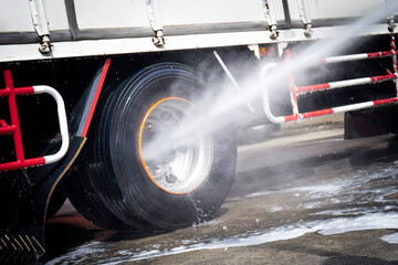 High Pressured Water Washing  a Truck Wheels and Tires. 