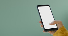 Woman Holding Black Phone Showing White Touch Screen. The Idea For Inserting Copy Space. Paste Text. Mobile Mockup. Pastel Marin Green Background.