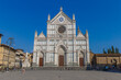 Firenze, Italy - August 16, 2021: street view of Piazza Santa Croce in Florence, people are visible in the far distance under a blue sky.