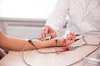 © romaset - Patient nerves testing using electromyography at medical center