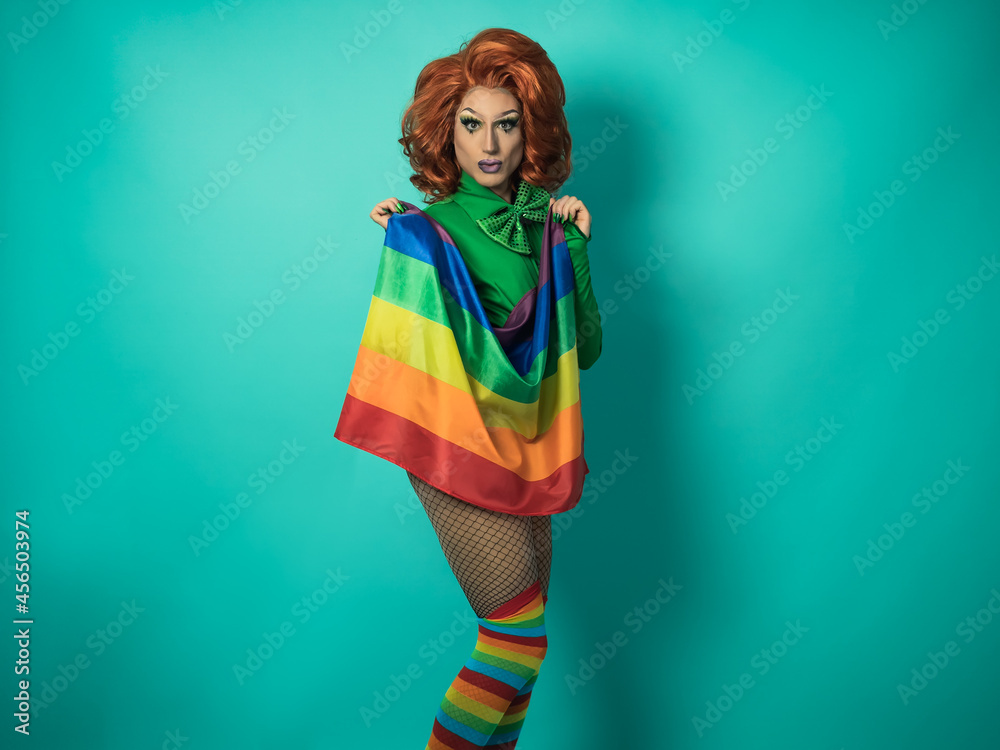 Happy drag queen celebrating gay pride holding rainbow flag - LGBTQ ...