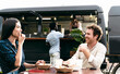 © Alessandro Biascioli - Happy multiracial friends eating in a street food truck market