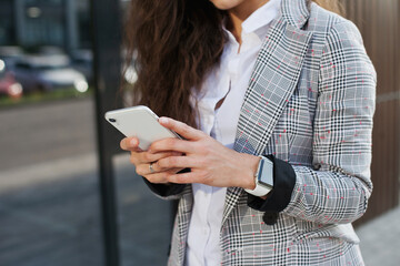 Young millennial woman using mobile phone