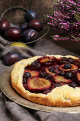 Canvas Print - Detail of the traditional round, plum pie.