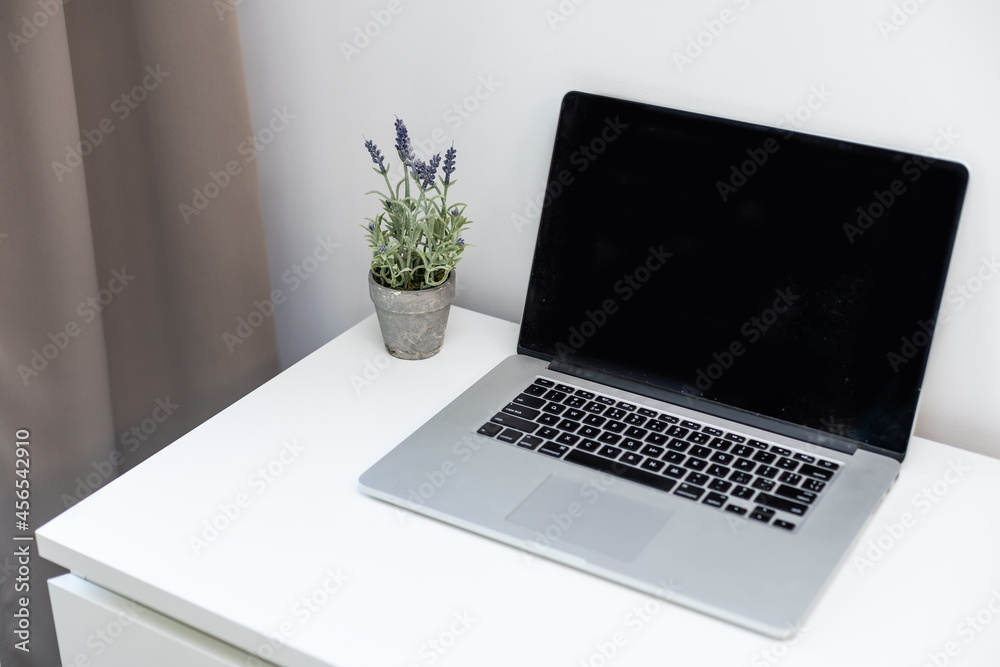laptop computer white blank screen on work table front view Stock Photo ...