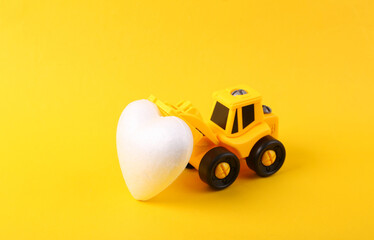 Sticker - Toy forklift with heart on yellow background