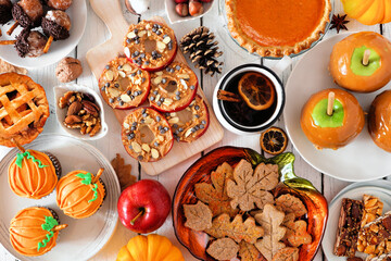 Aufkleber - Autumn desserts table scene with various sweet fall treats. Top view over a white wood background.