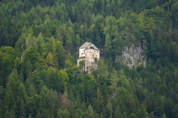 View of the old castle among the forest on a mountain in Austria