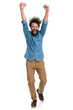 © Viorel Sima - casual man celebrating success and walking towards the camera