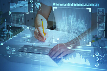 Poster - Businessman wearing white t-shirt is taking notes and typing