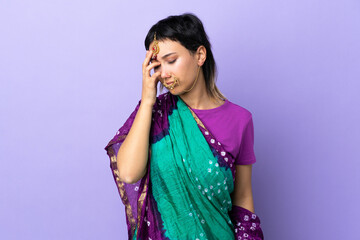 Wall Mural - Indian woman isolated on purple background with headache