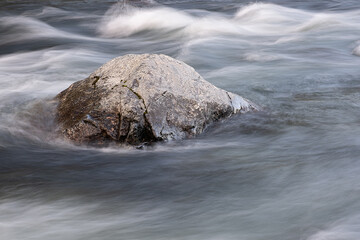 Poster - abstract background from long exposure of water stream in a mountain river close-up