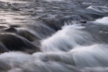 Poster - abstract background from long exposure of water stream in a mountain river close-up