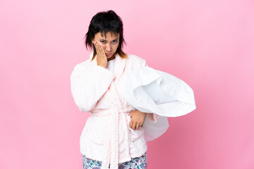 Wall Mural - Young Uruguayan woman in pajamas over isolated pink background unhappy and frustrated