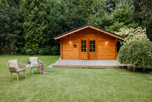 Wooden Holiday House. Wooden House In The Garden For Summer Days 