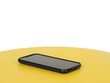 © Aline K Fernandes - Mobile phone isolated on a yellow table in perspective.
