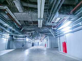 Poster - Indoor space next to stadium. Corridors for employees of concert venue. Engineering networks are stretched under ceiling. Engineering premises near concert venue. Engineering corridors.