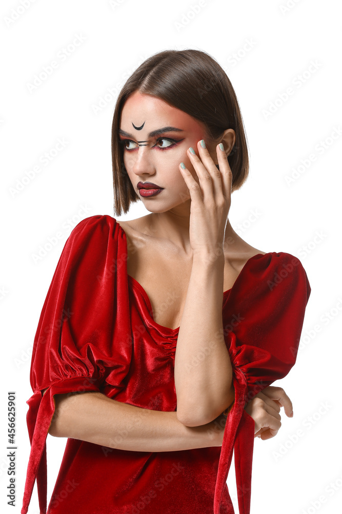 Beautiful woman dressed as witch for Halloween on white background