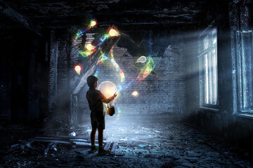 Wall Mural - Boy with a glowing light bulb