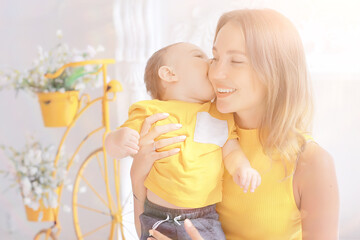 Wall Mural - mother with a small child toddler / two family mother and child motherhood, health with happiness