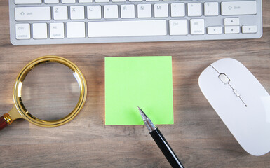 Sticker - Sticky note with a keyboard and business objects.