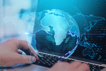 Aufkleber - Close up of hands at desktop using laptop keyboard with creative glowing globe interface on dark background. Technology, network and online data concept. Double exposure.