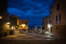 The Little Square Of Borgio Verezzi Full Of People In Its Restaurants During A Warm Summer Evening In 2021