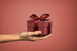 © Rido - Woman hand holding elegant gift box