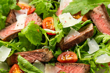 Wall Mural - Italian Beef Tagliata salad with wild rocket, cherry tomatoes and parmesan cheese