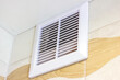 White plastic ventilation panel in the bathroom for air circulation.