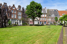Historic Houses In The Begijnhof, One Of The Oldest Courtyards (hofjes) In Amsterdam.