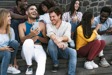  Young multiracial group of friends using mobile smartphone sitting on stairs - Youth millennial lifestyle concept